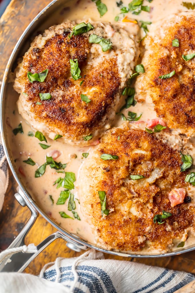 Skillet Basil Cream Chicken has always been one of my favorite recipes. Creamy sauce, breaded chicken, tomatoes, fresh herbs, and more make up this super easy, delicious, and fool-proof chicken dinner.