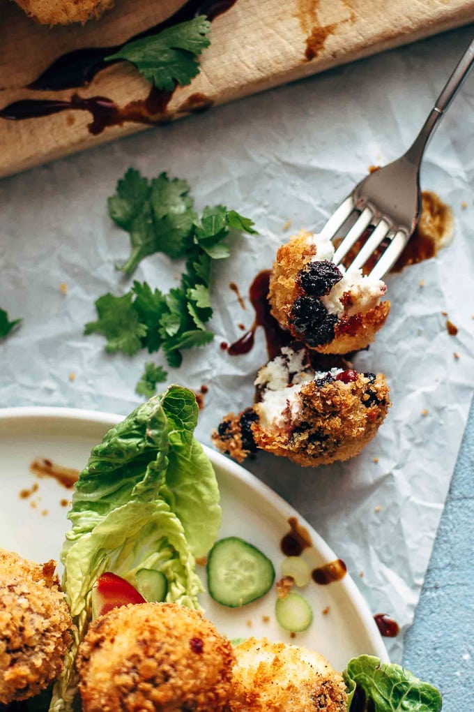 Fried goat cheese ball on a fork
