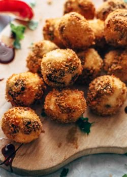 Fried Goat Cheese Balls are the perfect New Year's Eve appetizer! These goat cheese poppers are stuffed with dried cherries and pecans and then deep fried into a crispy little snack. It's definitely my favorite goat cheese appetizer!