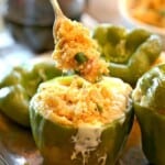 Quinoa Hawaiian Pizza Stuffed Peppers with a fork