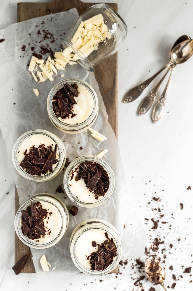 Easy Chocolate Mousse Recipe in small glass jars, topped with chocolate chunks