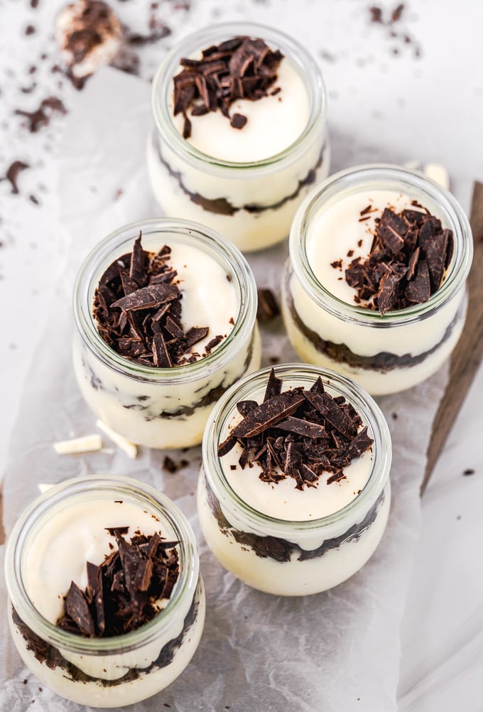 Small jars layers with white chocolate mousse and chocolate chunks
