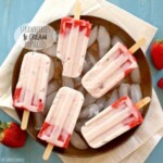 strawberry ice cream popsicles on a plate.