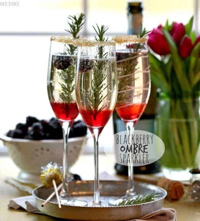 Blackberry Ombre Sparkler!! Made with Blackberry Simple Syrup, Champagne, and Rosemary. Perfect for Christmas and Valentine's Day! | The Cookie Rookie