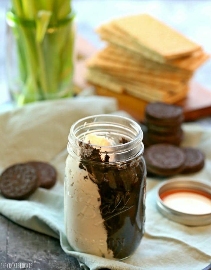 jar of cookie butter in front of oreos and graham crackers