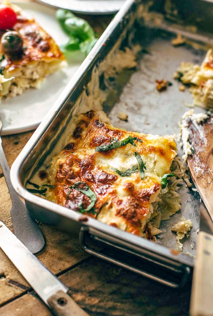 casserole dish with one slice of lasagna left inside