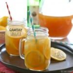 game day sangria with lemons and straws on a plate.