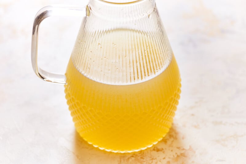 beer margarita mixture in a ribbed glass pitcher.