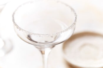 a salt-rimmed empty coupe glass.