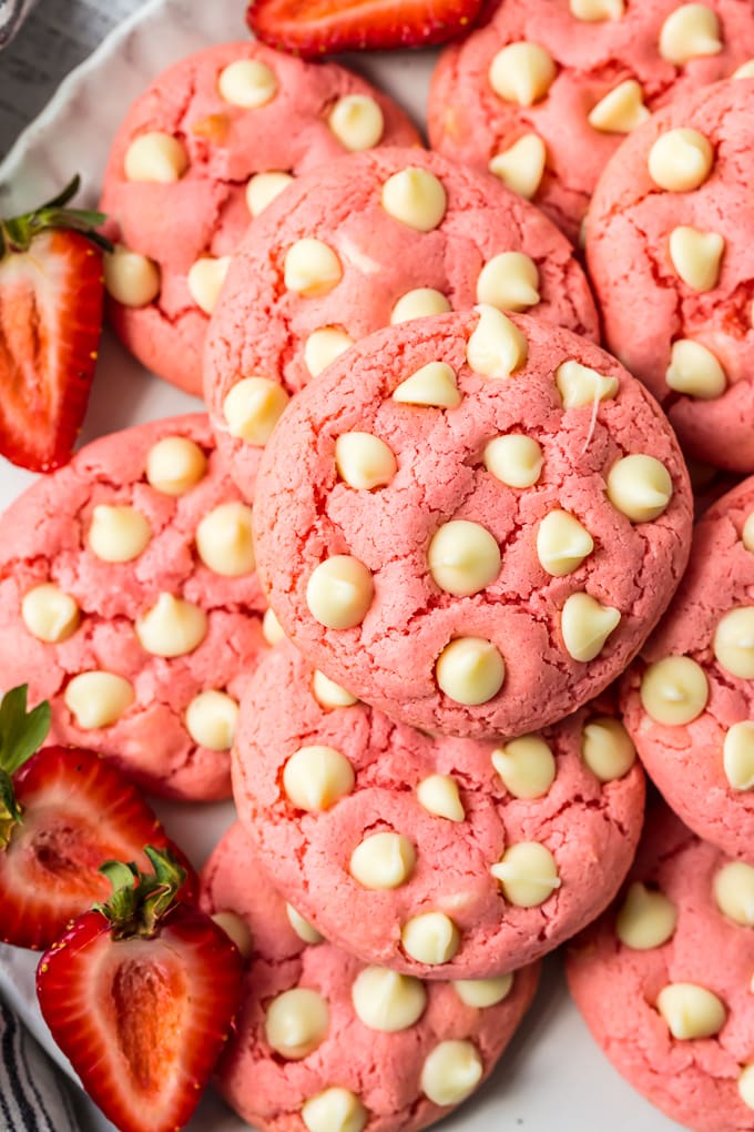 up close on a plate of strawberry cake mix cookies with white chocolate chips