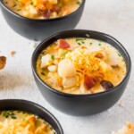 Crockpot Potato Soup is a Healthy Potato Soup we simply love. This Recipe for Potato Soup makes things easy by using a slow cooker! Set it and forget it...until it's time to eat. Just because this is a healthy version doesn't mean it's any less flavorful than your favorite Potato Cheese Soup. Crockpot Loaded Potato Soup for the win!