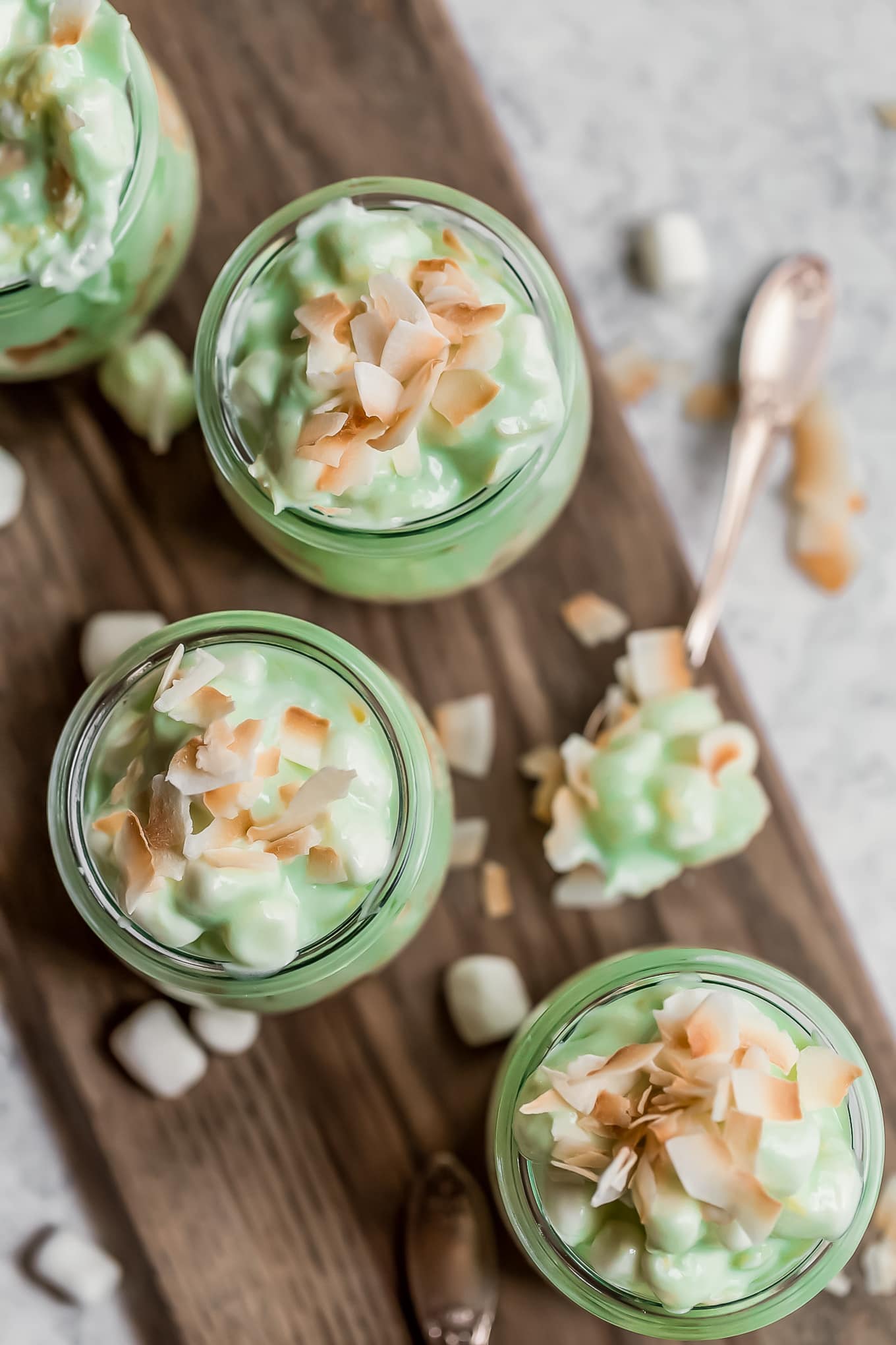 overhead view of pistachio fluff in small jars