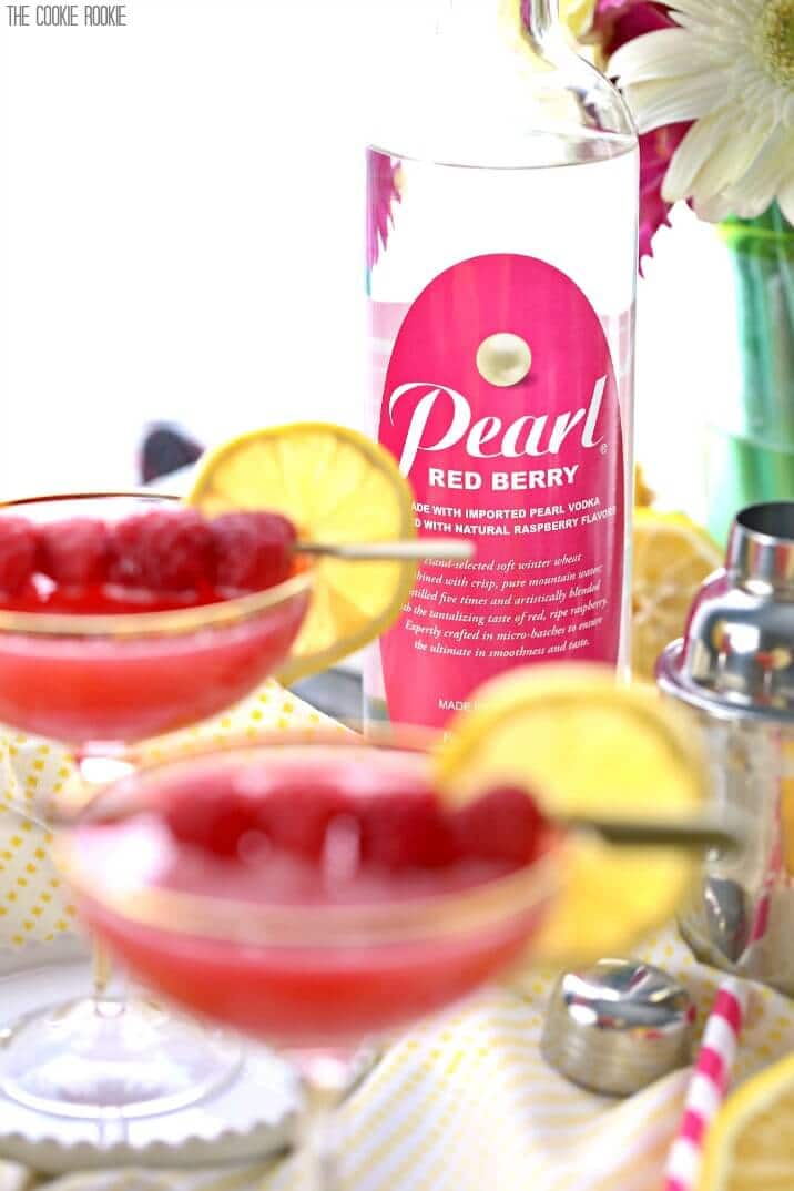 martinis in front of a bottle of pearl red berry vodka