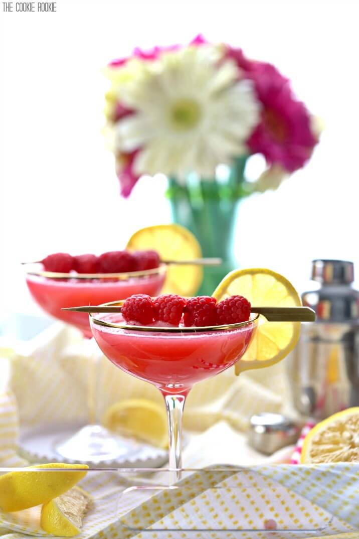 martinis in front of a vase of flowers