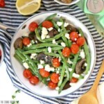green beans, tomatoes and mushrooms in a skillet.