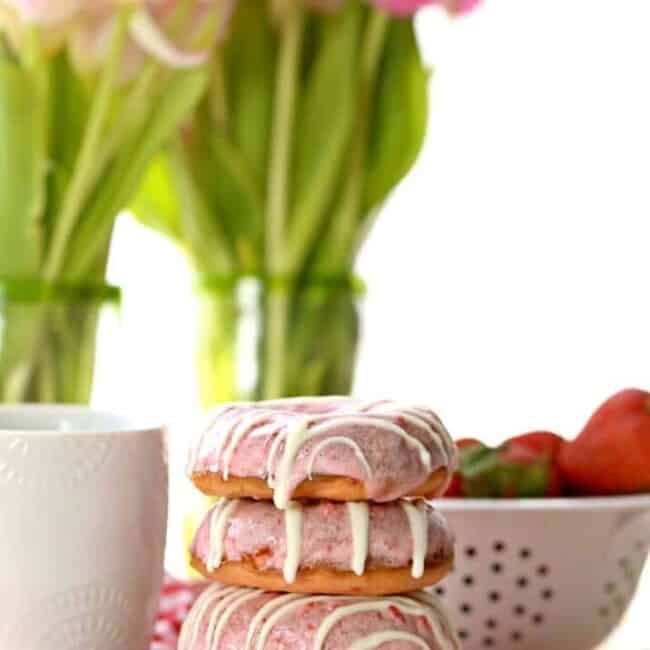 strawberries and cream donuts on a plate