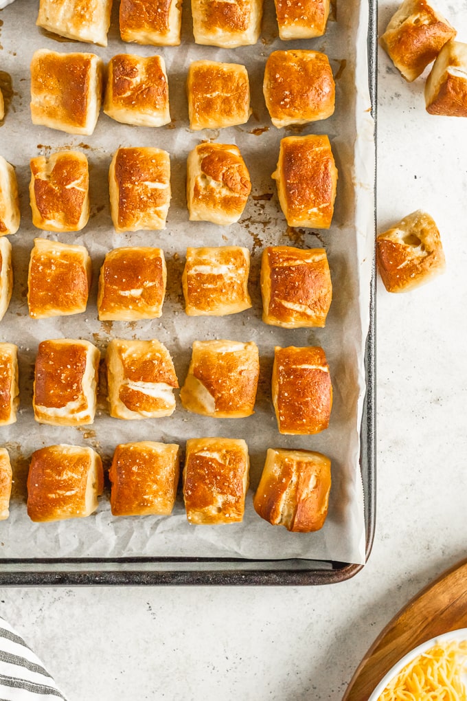 close up of pretzel bites on sheet with parchment paper