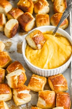 Soft Pretzel Bites are the perfect party food! ANYONE can make this easy pretzel bite recipe and EVERYONE will love them! I was scared to make these but they turned out o good and were actually super easy. WIN! I love the texture and taste of these homemade pretzel bites, and I really love dipping them in ALL the sauces.