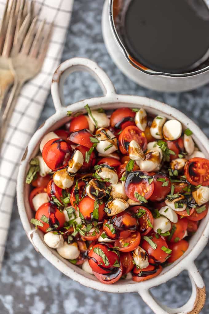 Chopped Caprese Salad is the perfect easy side dish for any BBQ! Simple, delicious, and healthy! Tomato, Mozzarella, Basil, and Balsamic Vinegar. A family favorite!