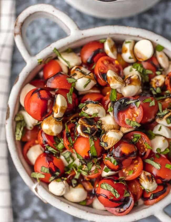 Chopped Caprese Salad is the perfect easy side dish for any BBQ! Simple, delicious, and healthy! Tomato, Mozzarella, Basil, and Balsamic Vinegar. A family favorite! This Caprese Salad Recipe (Tomato Mozzarella Salad) is my go-to side dish for everything Summer!