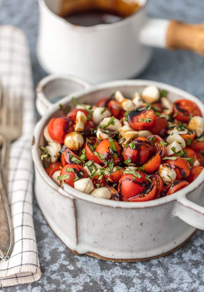 chopped caprese salad with basil, balsamic, tomato, and mozzarella