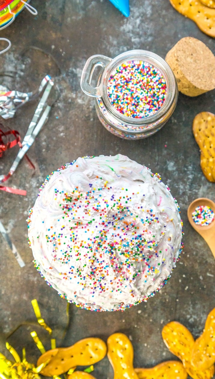 dip next to a jar of rainbow sprinkles