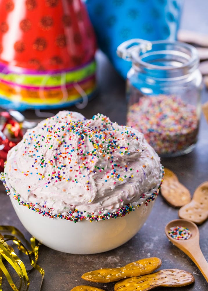 dip, sprinkles, and party hats on a table