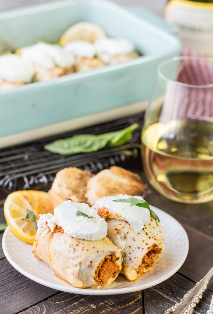 Stuffed Chicken Bryan Rollups! This variation on our favorite Carrabba's recipe is a favorite at our house! Chicken stuffed with a sun dried tomato and goat cheese mixture and then topped with lemon butter sauce and fresh basil! TO DIE FOR!