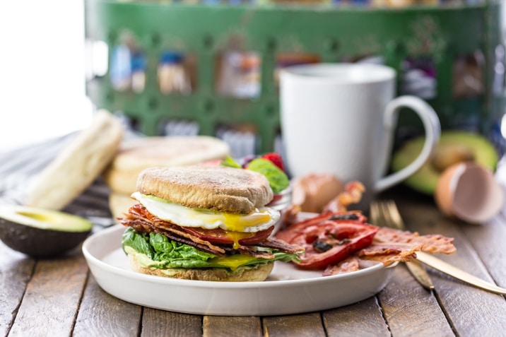 english muffin blt with egg on plate 