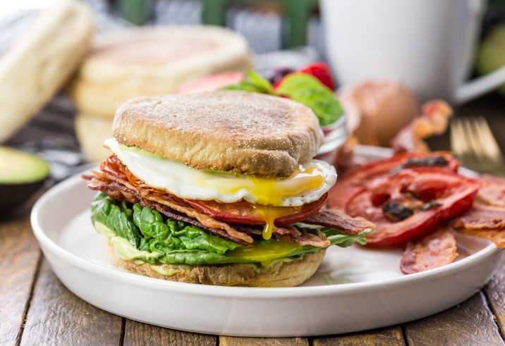english muffin loaded blt sandwich on a plate