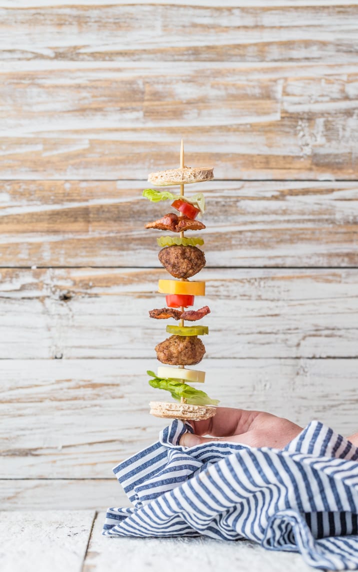 cheeseburger ingredients stacked on a stick