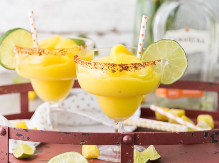 It doesn't get better than SUPER EASY Chili Mango Margaritas! Only 5 ingredients make up this perfect drink, made non-alcoholic or in cocktail form. CHEERS!