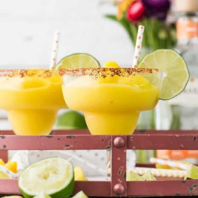 margaritas garnished with lime