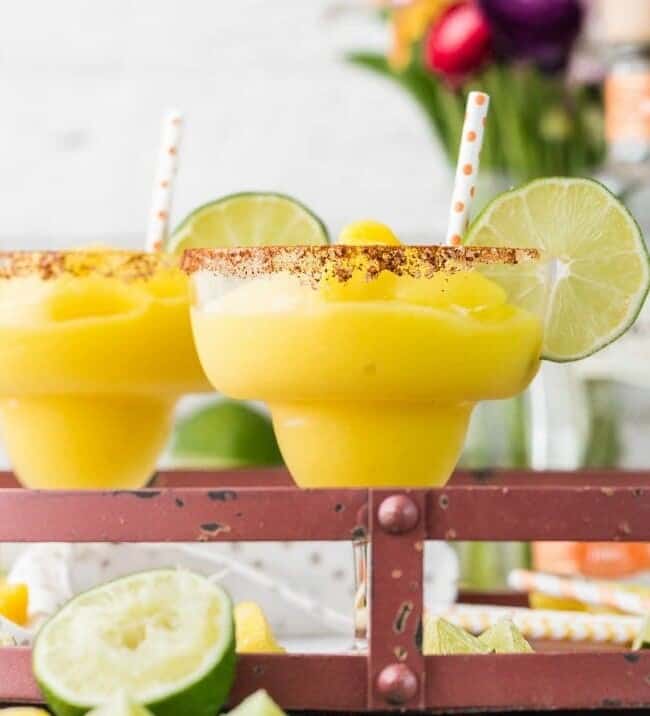margaritas garnished with lime