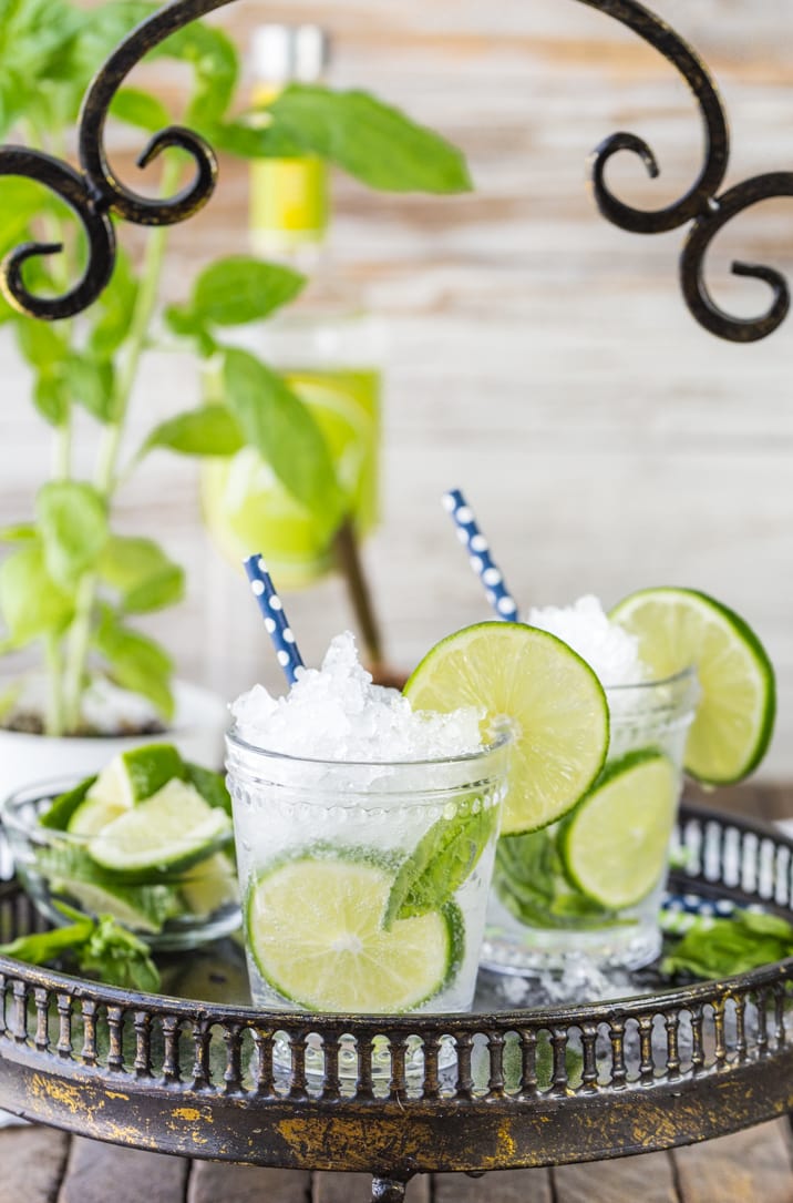 italian mojitos garnished with limes and straw