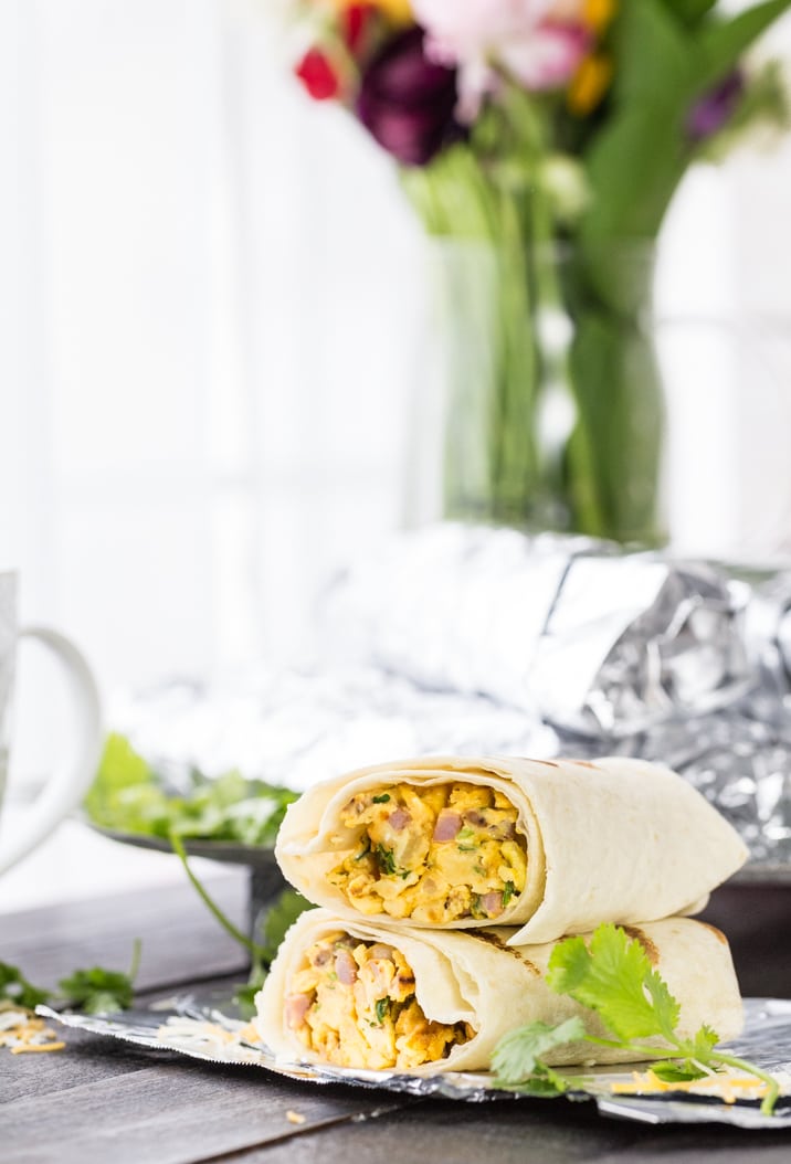 Southwest Make Ahead Breakfast Burritos stacked on a table