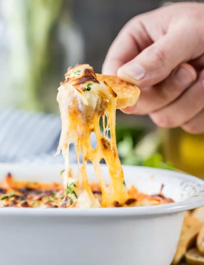 Queso Fundido is the dreamy Crock Pot Queso Recipe of your dreams! Slow Cooker Queso Fundido with Chorizo couldn't be easier, creamier, or more delicious! If you're celebrating something...from Cinco de Mayo to the Super Bowl, this Easy Cheese Dip with Sausage is the perfect recipe.