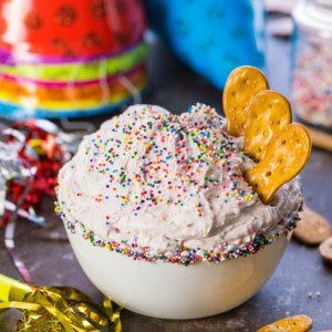 funfetti cake batter dip with pretzels in a bowl