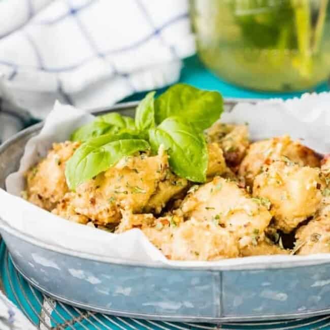 Garlic Parmesan Wings are one of our favorite wing flavors. We're making this slow cooker garlic parmesan chicken wings recipe by cooking them with our homemade garlic parmesan wing sauce. This is one of the best crockpot wings recipe, and definitely our fave garlic parm wings ever!