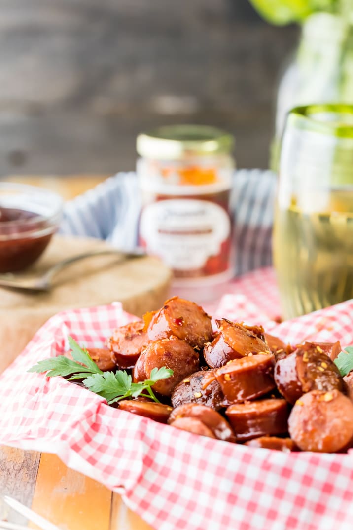 kielbasa sausage bites in a basket with red and white checked paper