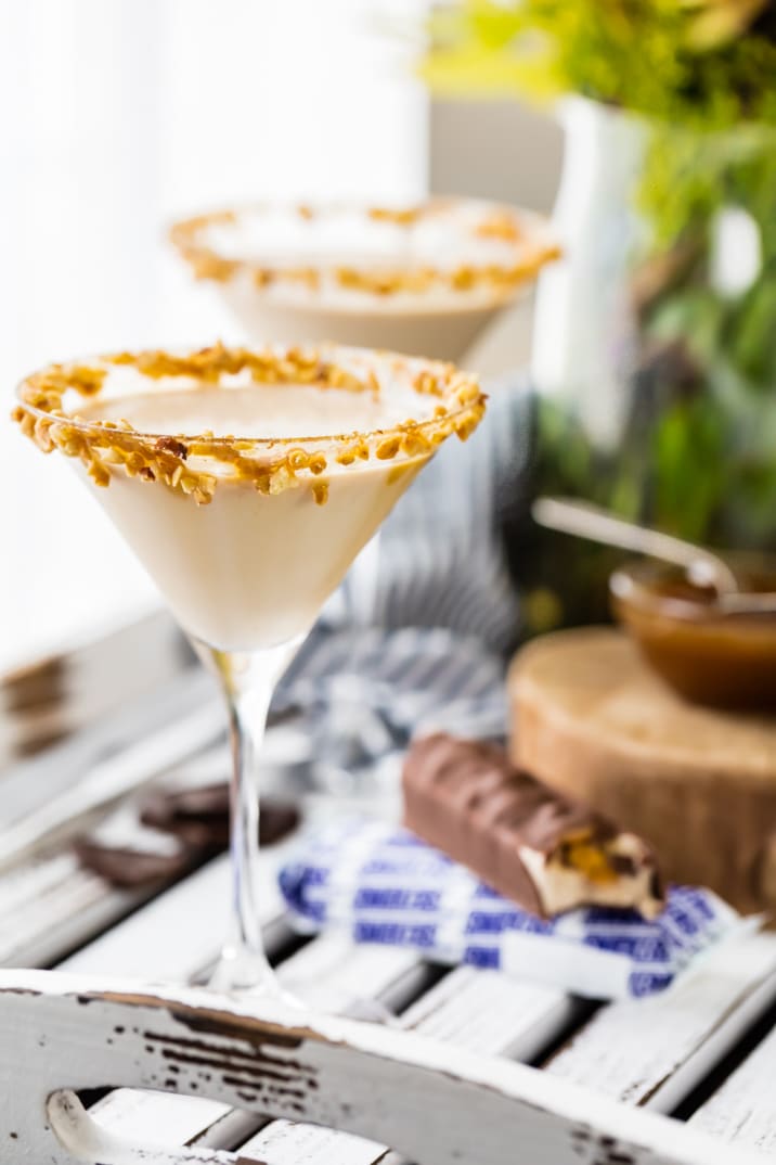 creamy snickers martinis on a table