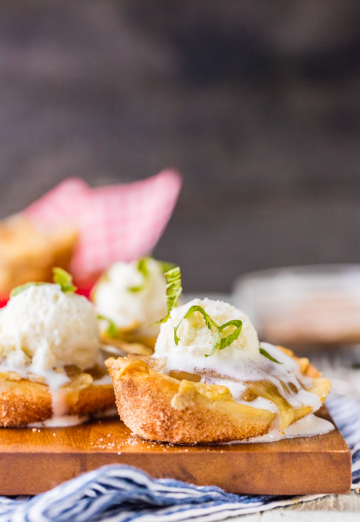 apple pie taco boat with ice cream melting onto wooden platter