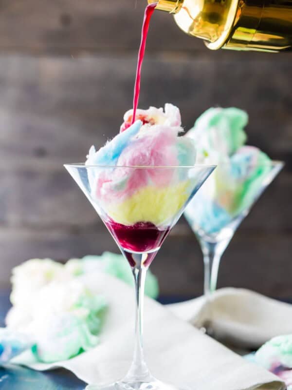 Magic Cotton Candy Martini (Plus Kid Friendly Version). There are SO FUN for Halloween or any time! The Cotton Candy dissolves in the juice!