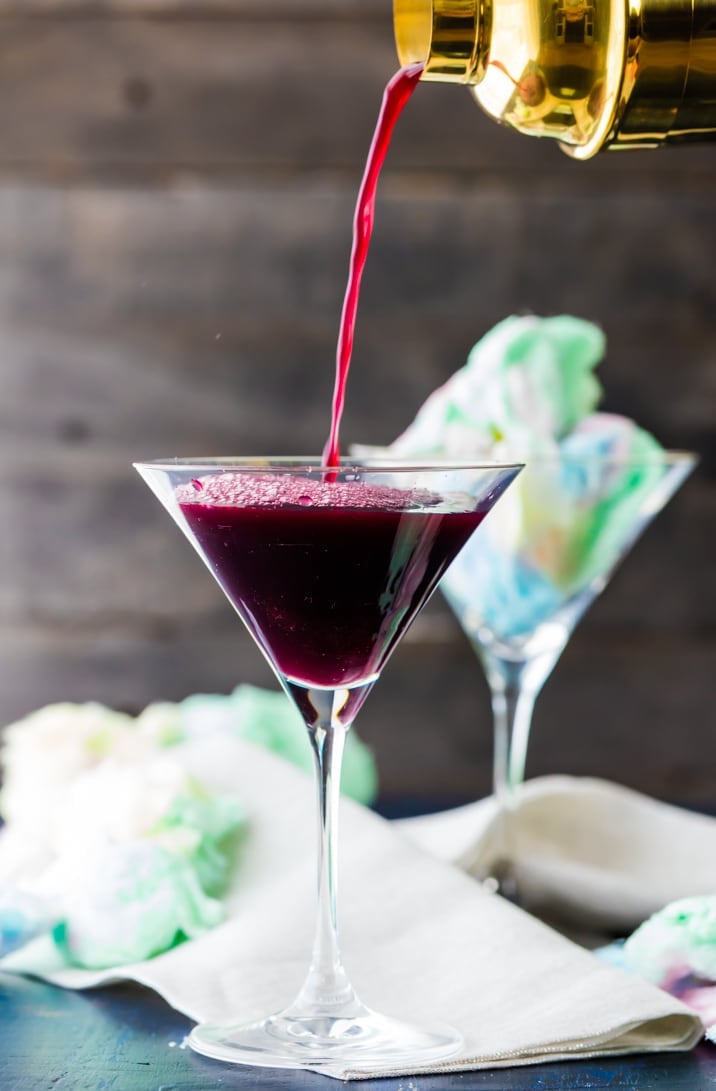 cocktail being poured into glass