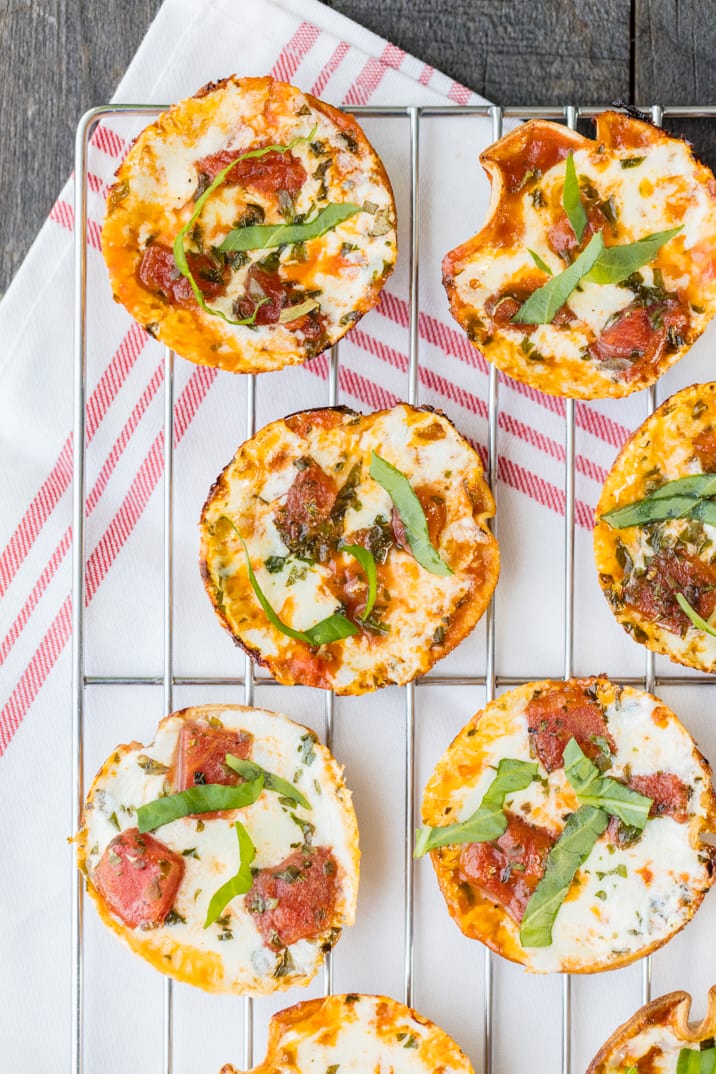 mini pizzas arranged on a baking rack