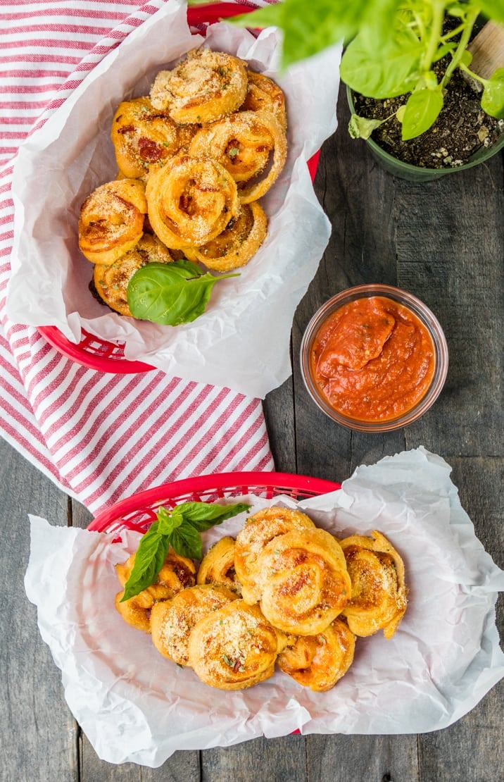 top view of rolls in baskets next to a dipping sauce