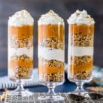 Cheesecake & Pumpkin Pie Parfaits! The perfect healthy(er) alternative to our favorite Thanksgiving pie! Loaded with cinnamon granola, no bake cheesecake, and pumpkin pie!