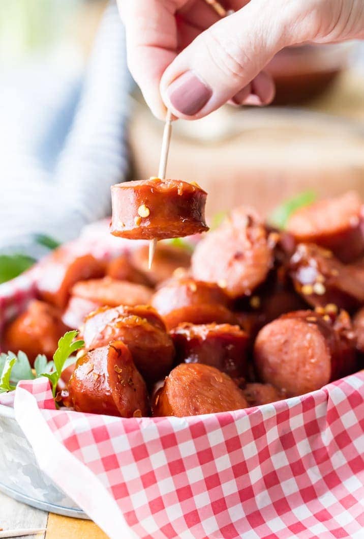 sweet and spicy kielbasa held up with a toothpick