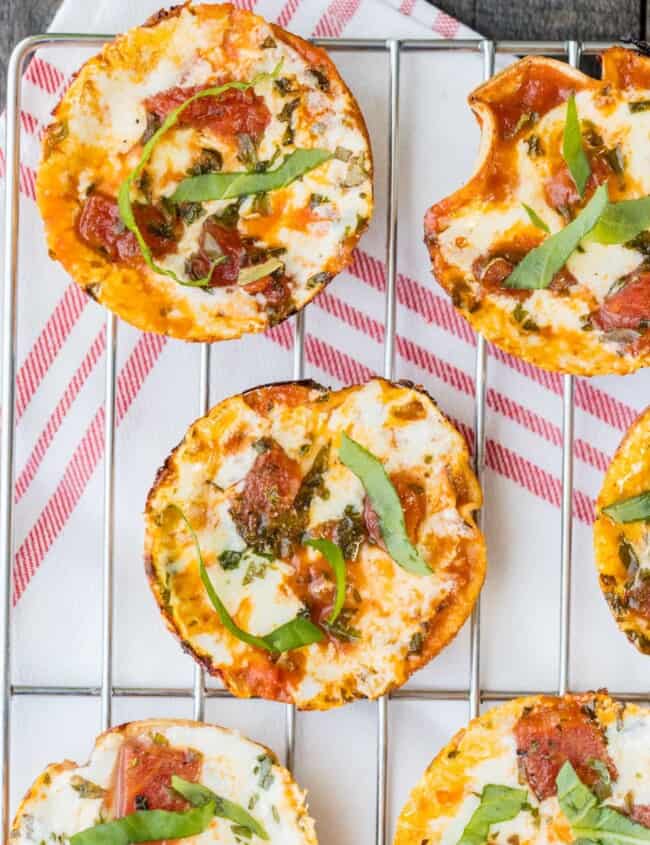 Mini Margherita Pizzas are THE BEST tailgate recipe! Delicious, easy, amazing appetizer perfect for any party or tailgate! YUM!