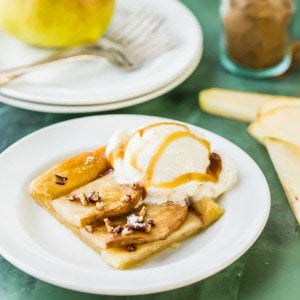 pear tart on a plate with ice cream